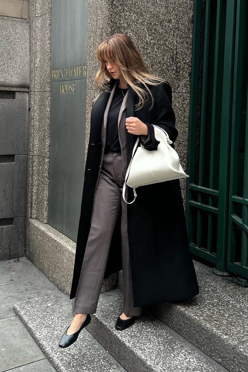 Sleek Black Long Coat with Gray Suit