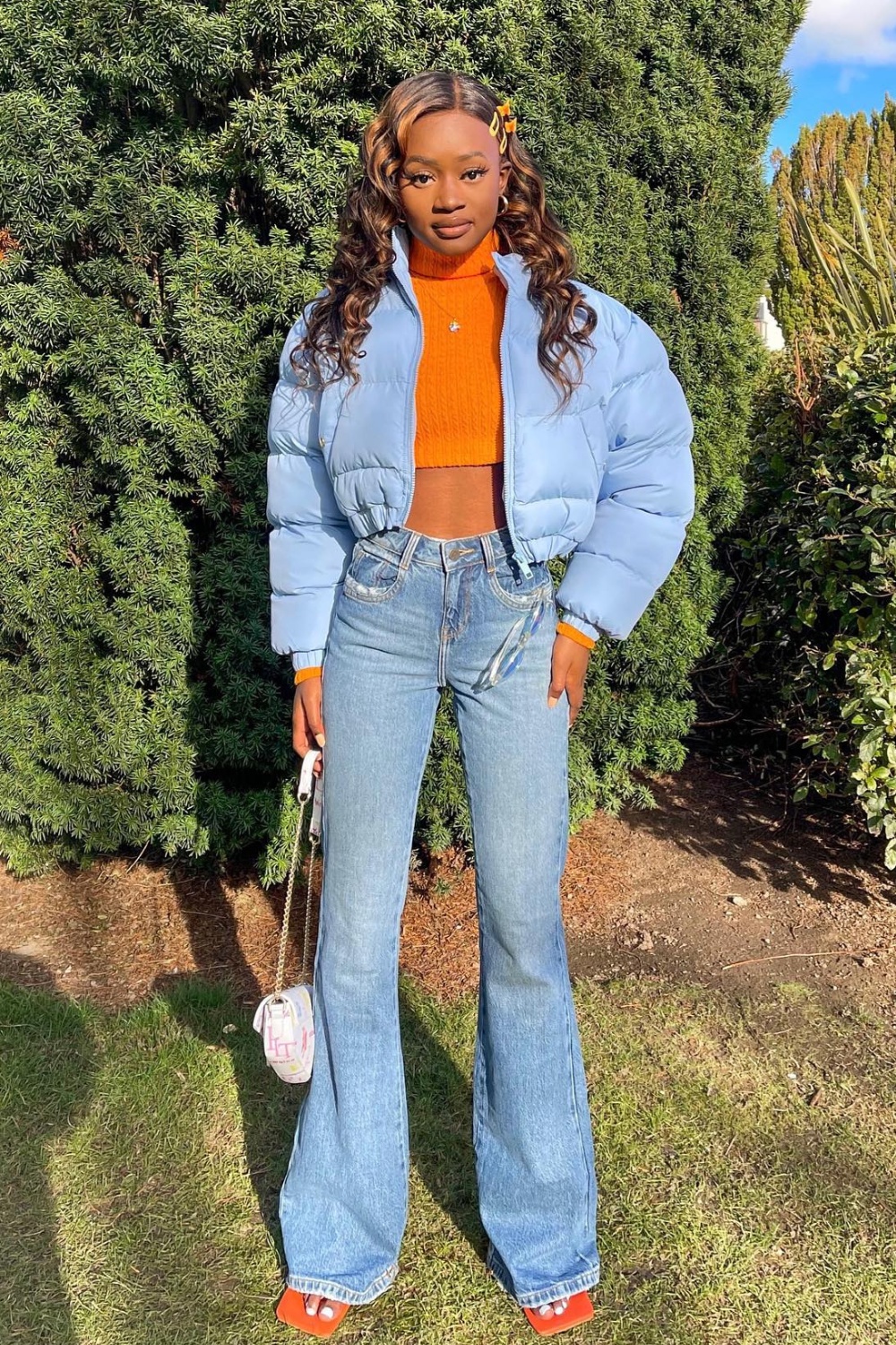 Cozy Cool: Orange Cropped Sweater and Light Blue Puffer