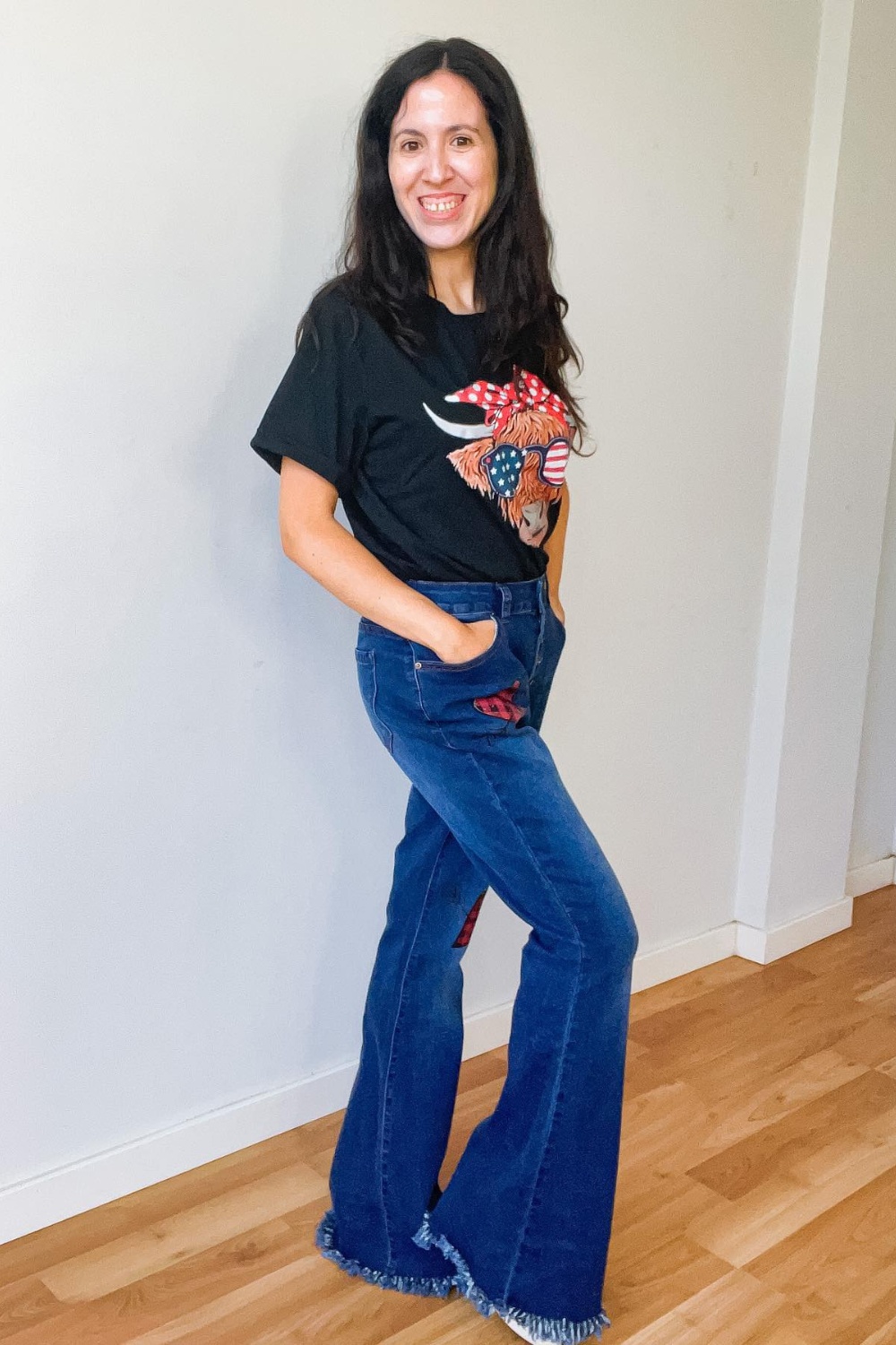 Rocker Chic: Black Graphic Tee and Frayed Hem Jeans