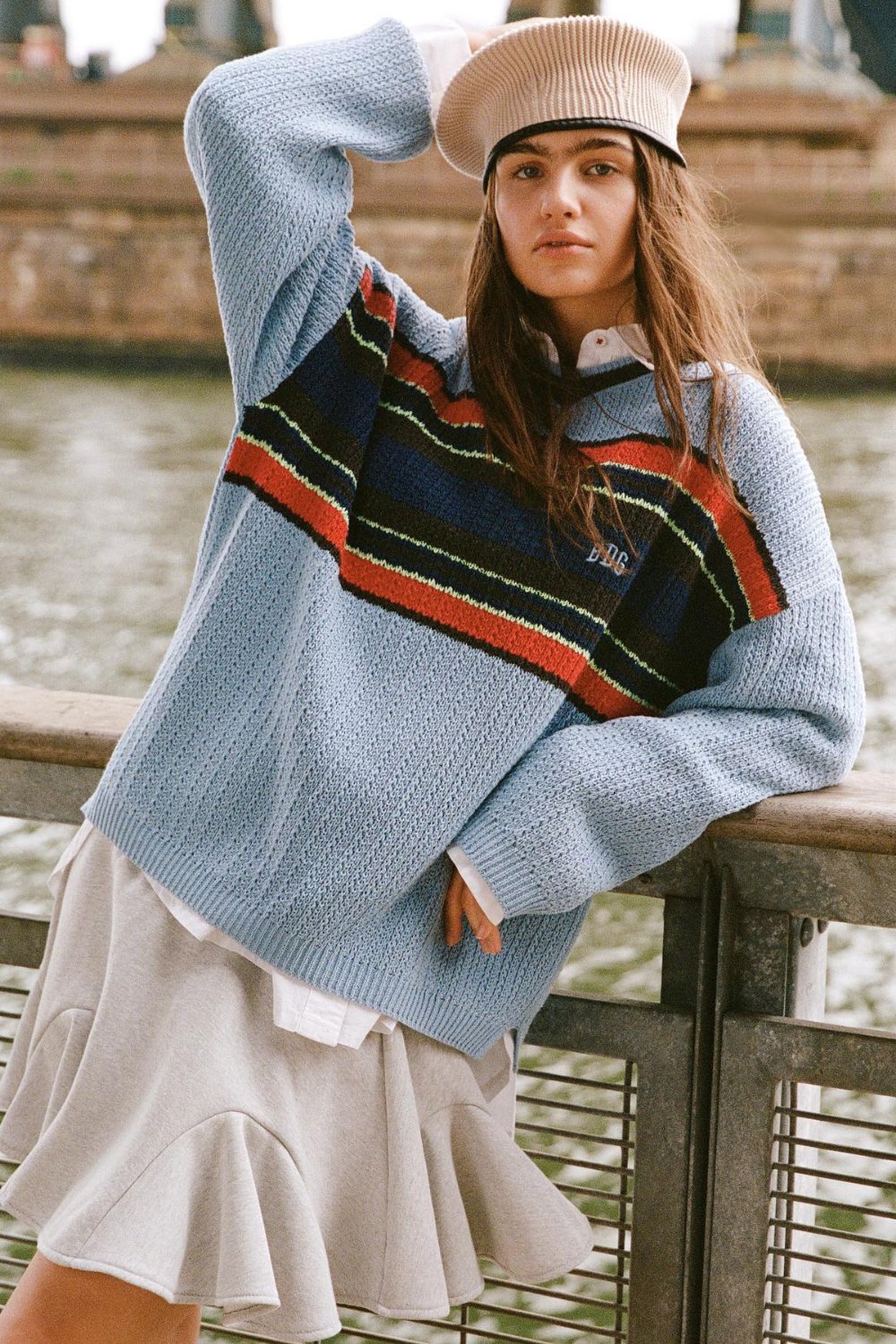 Striped Sweater, Pleated Skirt, and Beanie