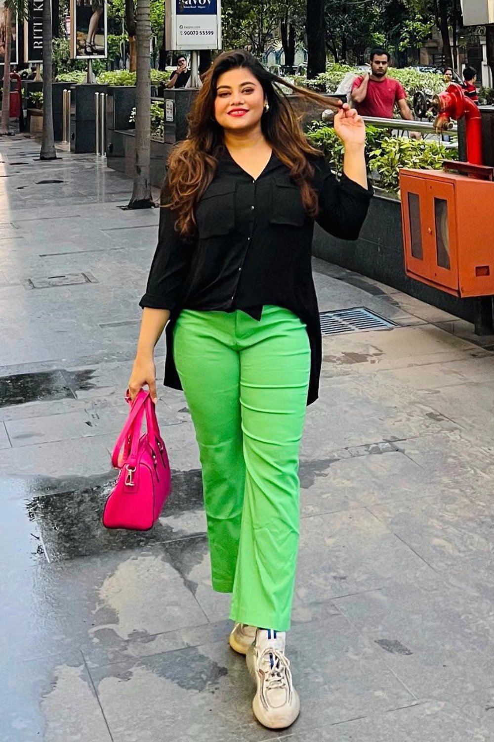 Black Button-Up Blouse and Bright Green Pants