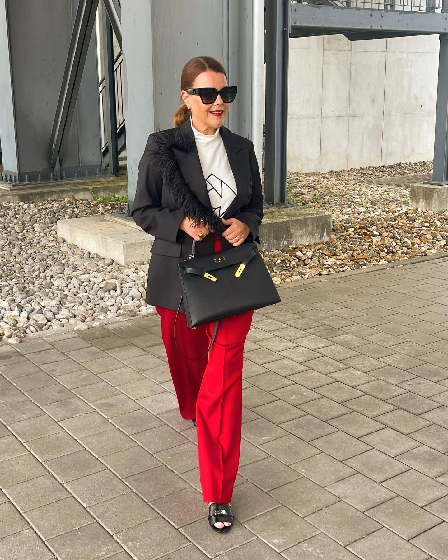 Feather-Trimmed Blazer and Red Trousers