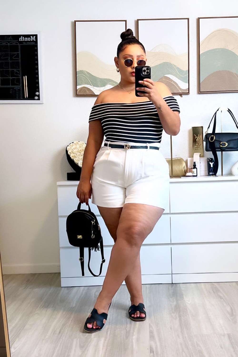 Black Off-Shoulder Top with White Stripes and High-Waisted Shorts