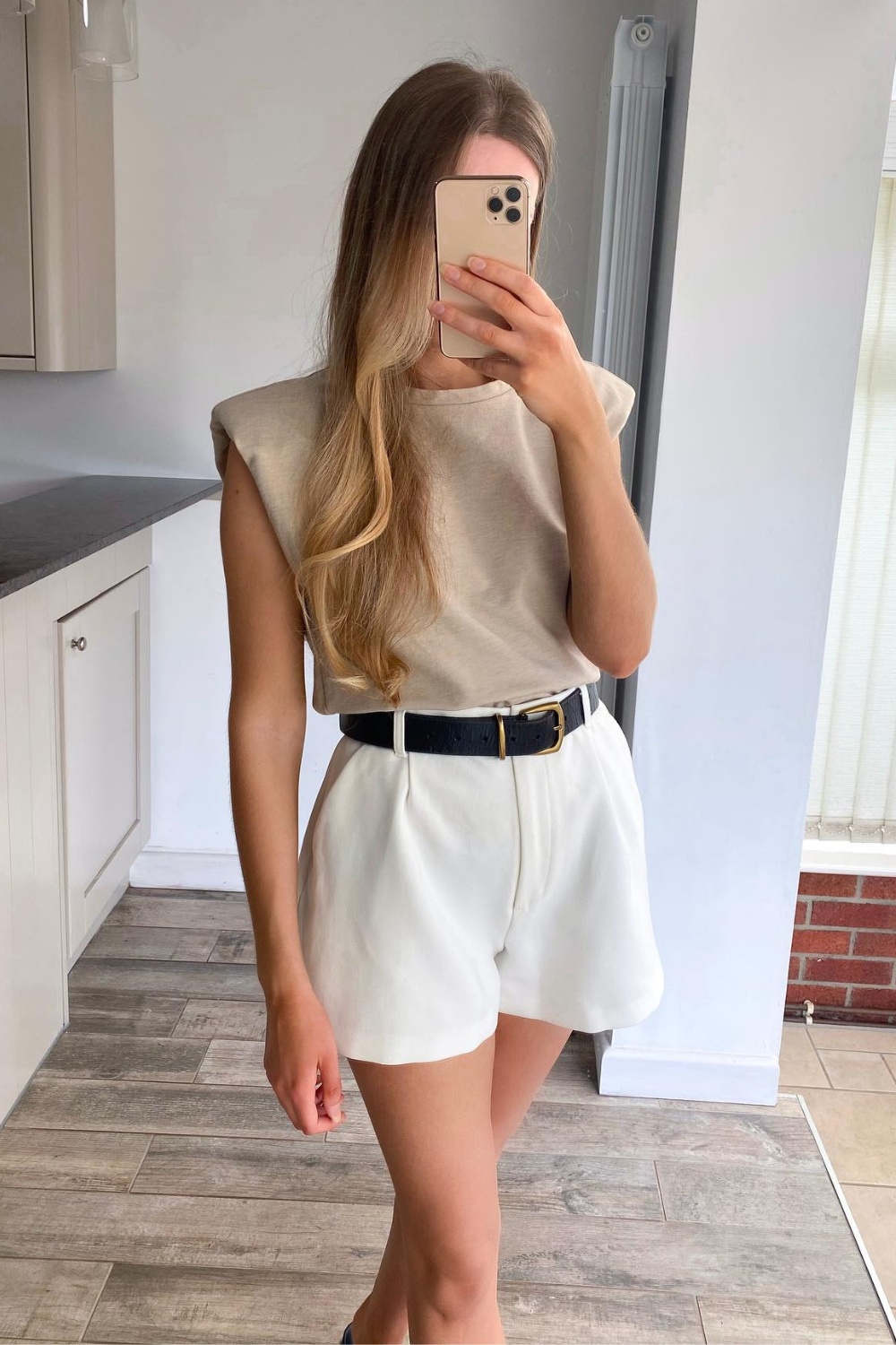 Beige Sleeveless Top and White Shorts