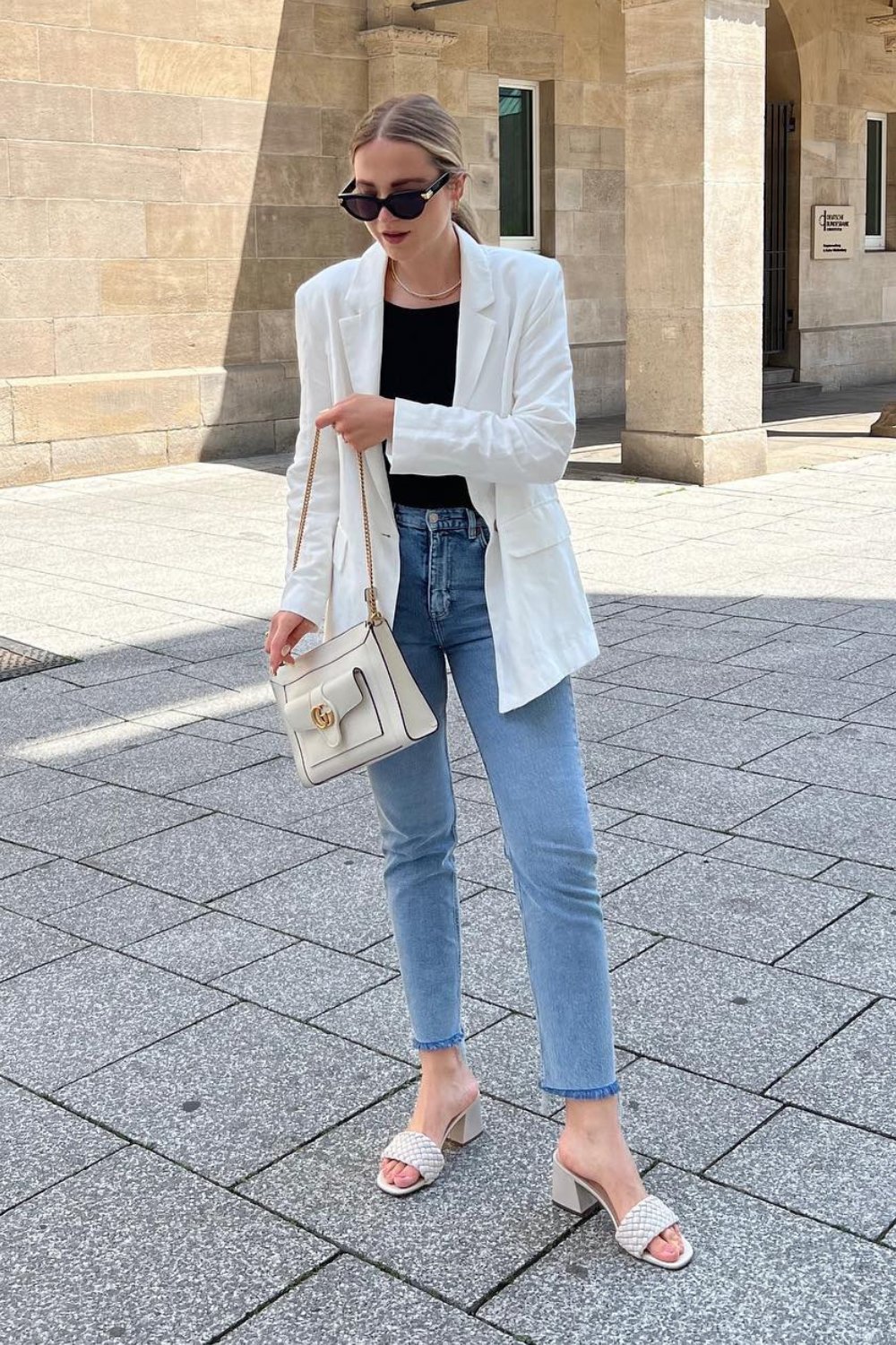 White Oversized Blazer + Black Top + Light Blue Jeans