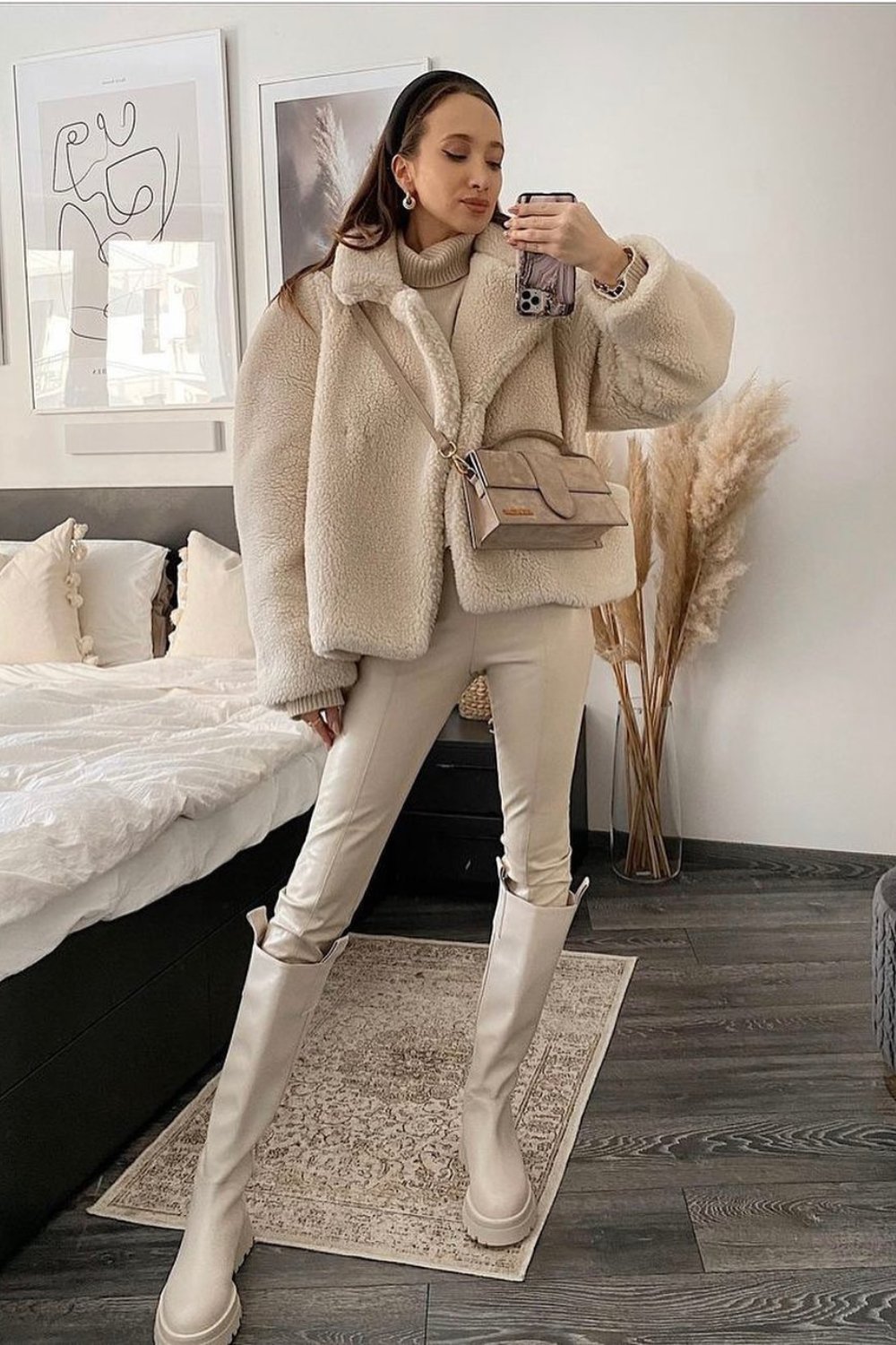 Beige sweater and coat with skinny pants and boots