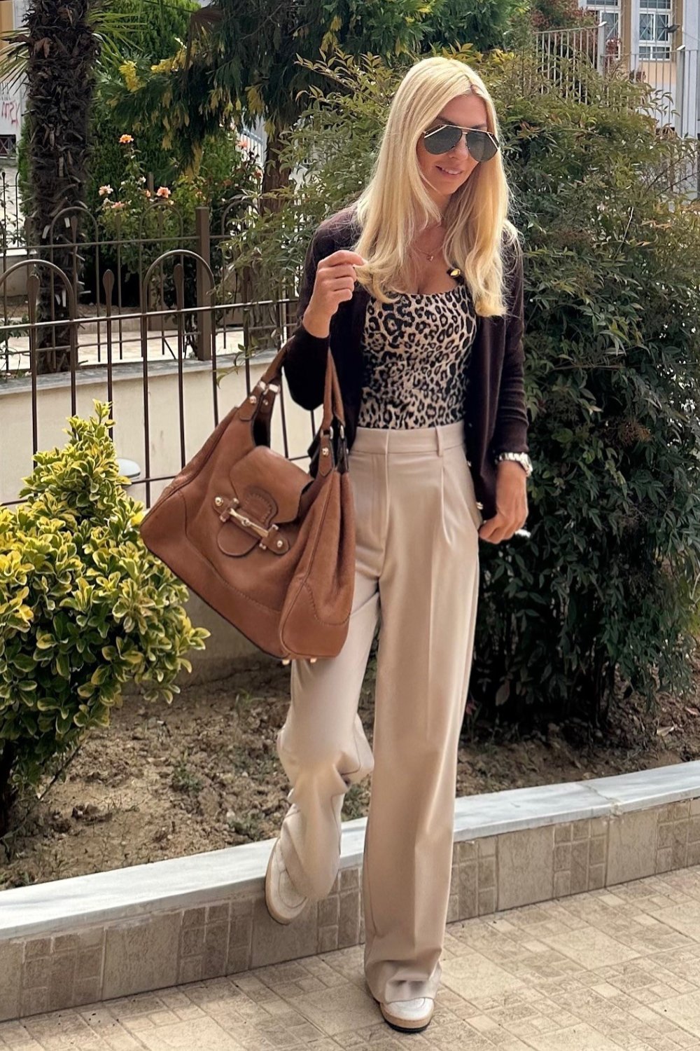 Leopard bodysuit with beige wide-leg pants