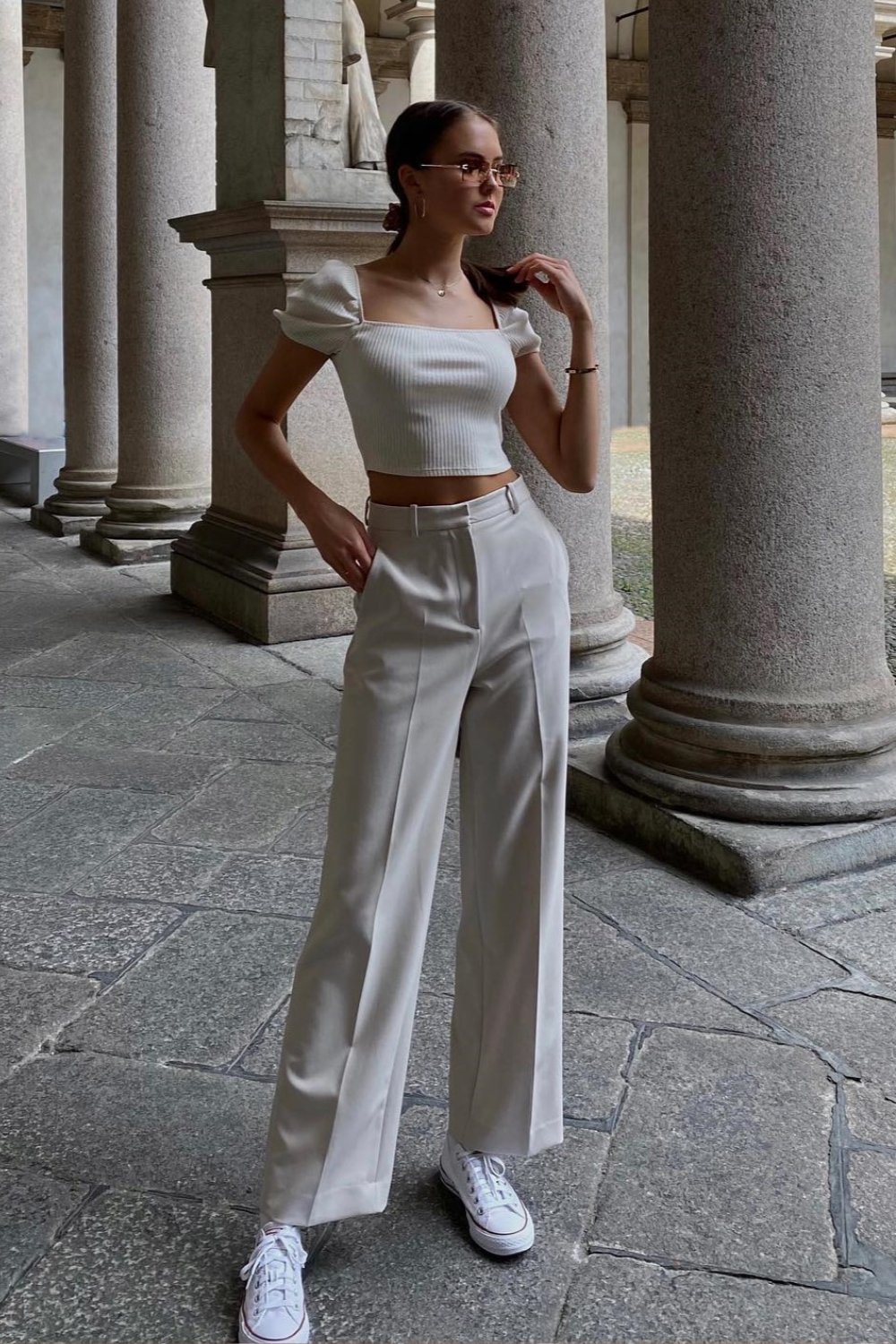 White puff sleeve crop top with beige trousers