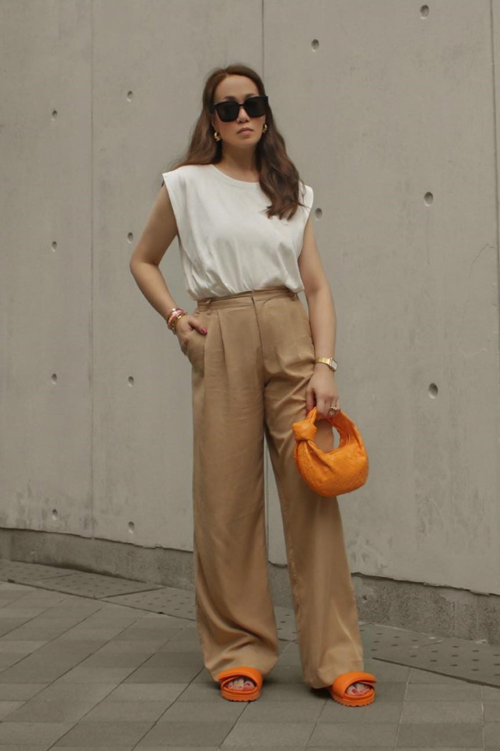 White sleeveless top with trousers