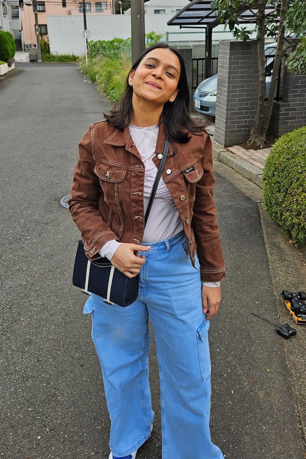 Brown Leather Jacket, White T-Shirt, and Blue Jeans