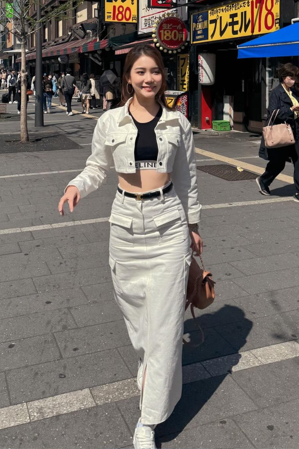 White Denim Jacket, Black Crop Top, and Sneakers