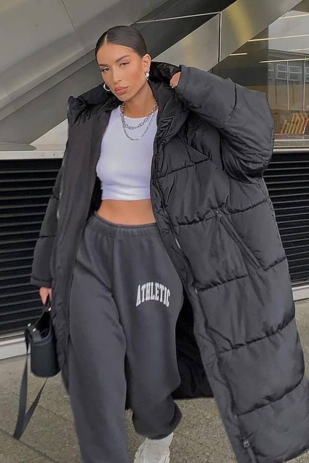 Black Oversized Puffer Coat, Gray Sweatpants, and Sneakers