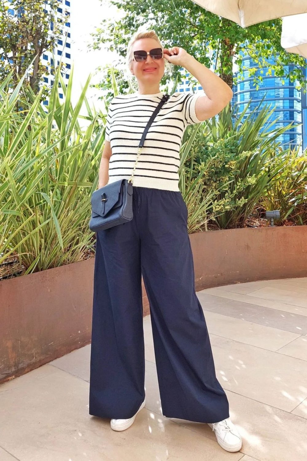 White Striped Short-Sleeve Top, Navy Wide-Leg Pants, White Sneakers