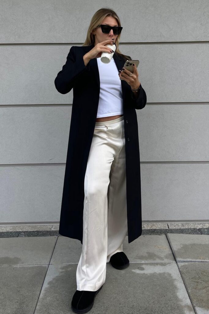 Long Black Coat and Cream Silk Pants