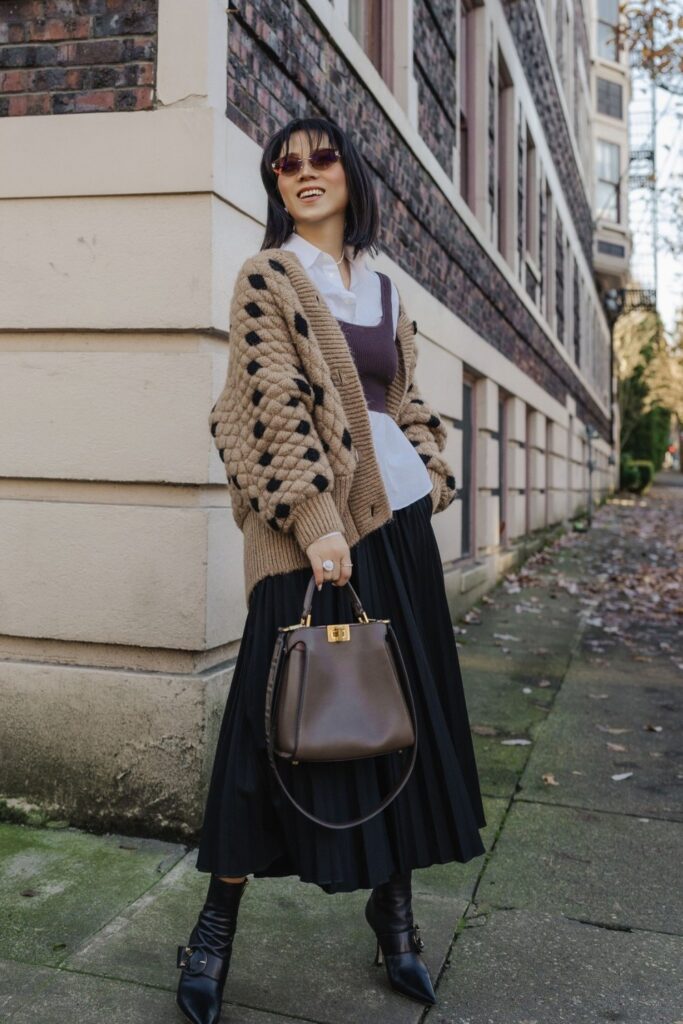 Beige Cardigan and Black Pleated Midi Skirt