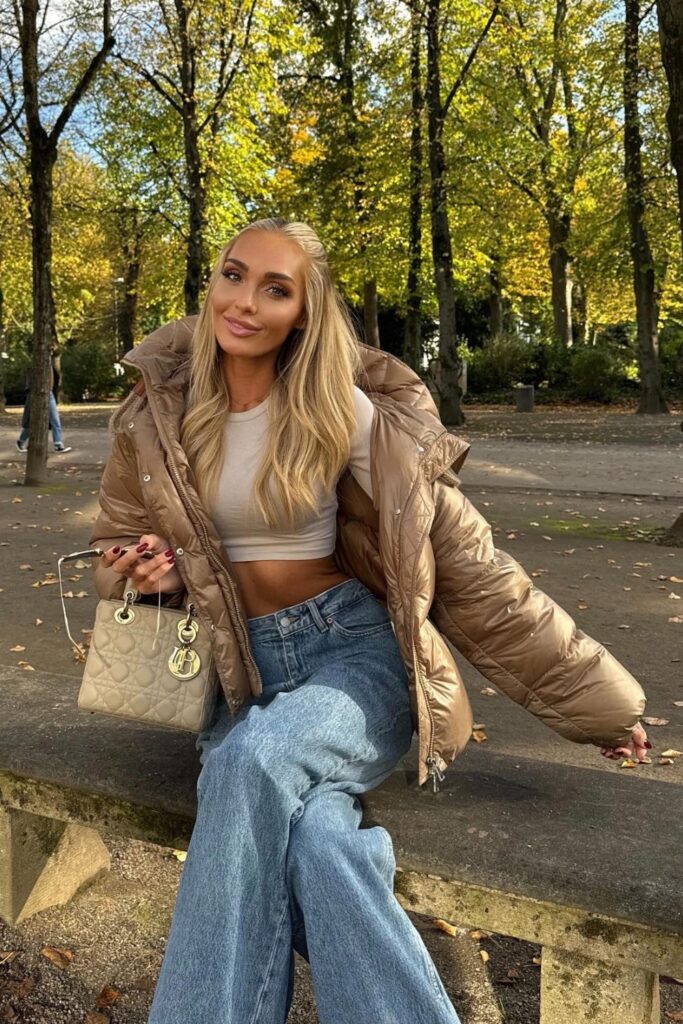 Puffer Jacket, Crop Top, Wide-Leg Jeans, and Quilted Handbag