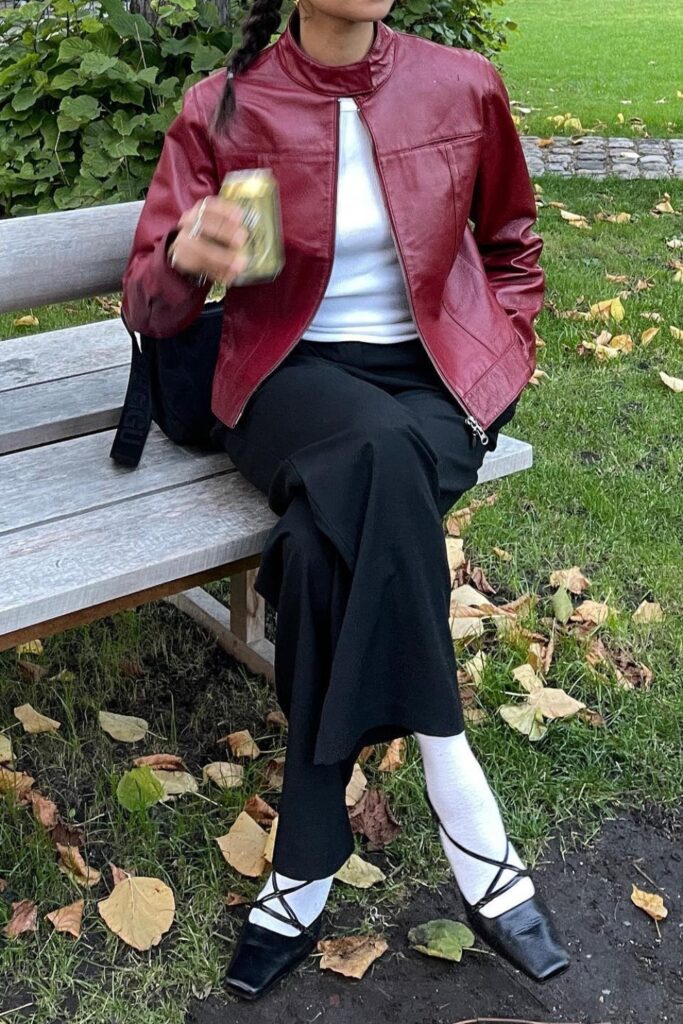 Burgundy leather jacket, white t-shirt, black wide-leg pants, and square-toe kitten heels