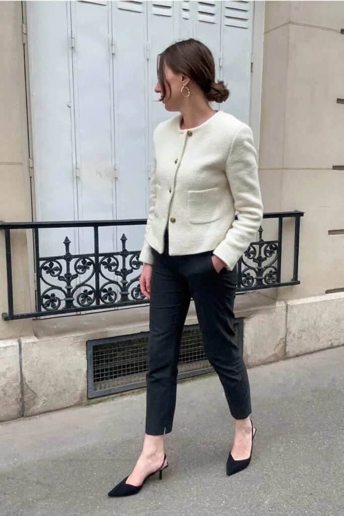 White tweed jacket, black tailored trousers, and black slingback kitten heels