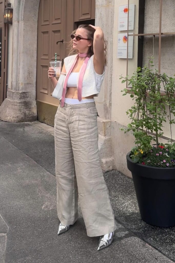 White cropped tank top, beige wide-leg linen pants, white cropped cardigan, and silver kitten heels