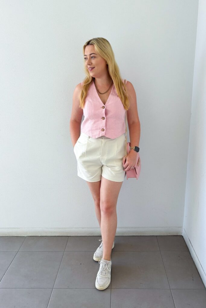 Pink Vest and Cream Shorts