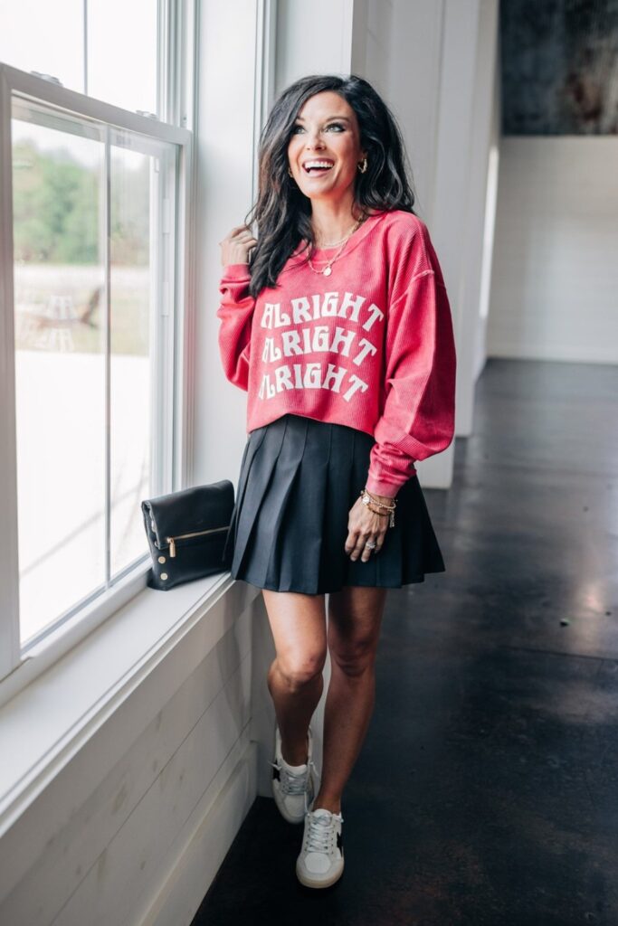 Red Sweatshirt and Black Skirt