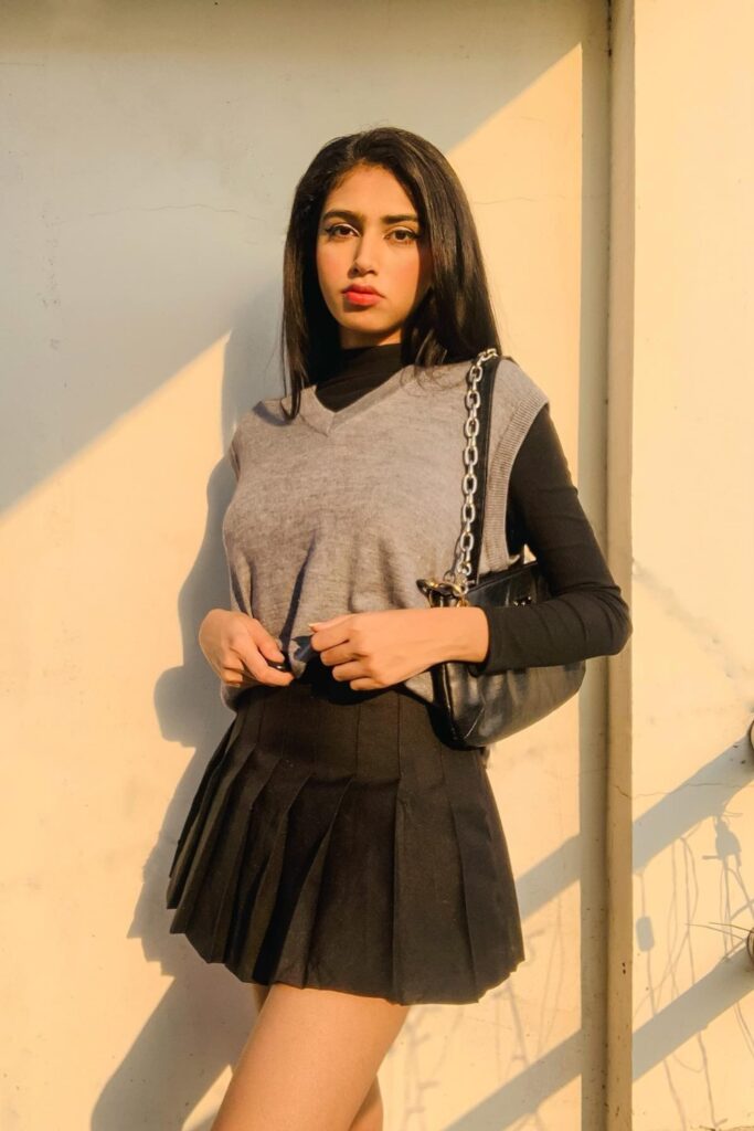 Gray Sweater Vest and Black Skirt